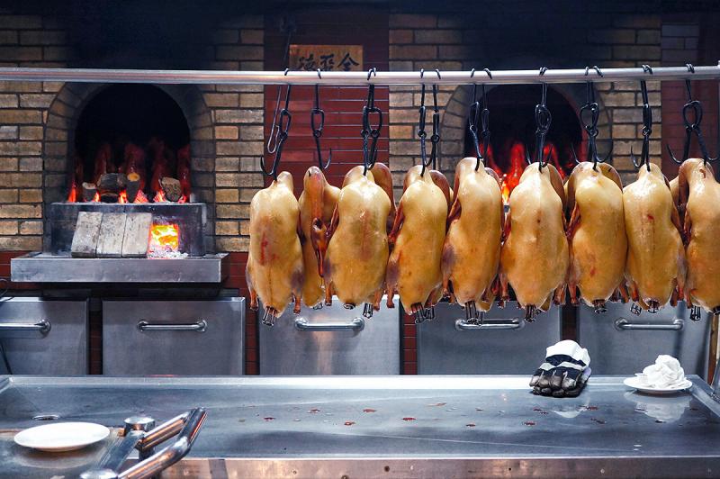 Peking duck roasted in hung oven at Quanjude, Beijing China