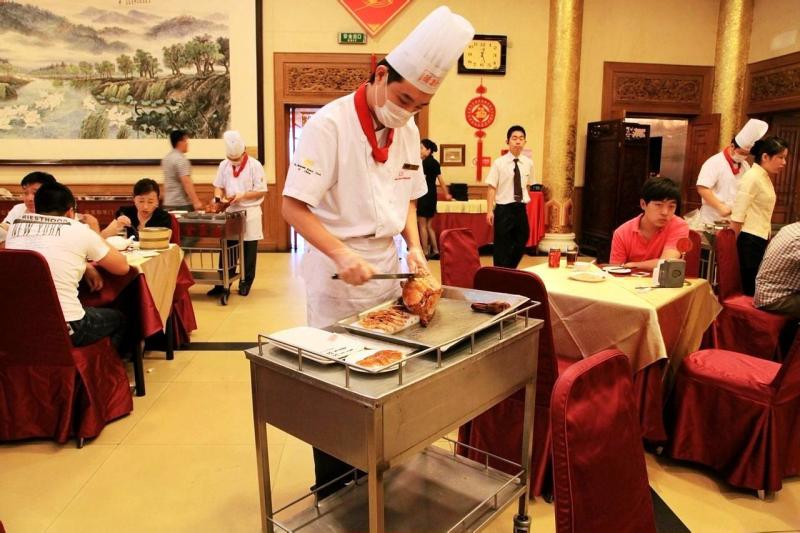 chef slicing Peking Duck at Quanjude,Beijing China